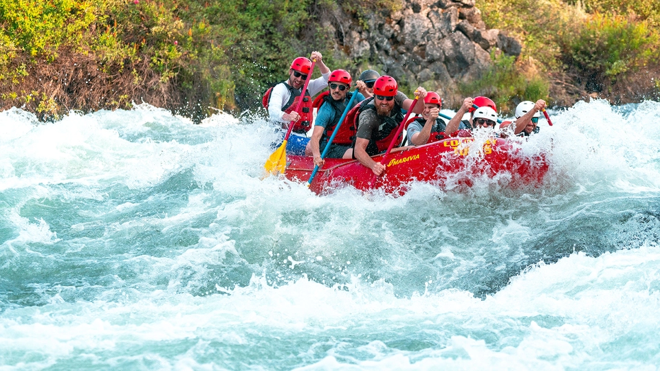 Guided rafting trip down the whitewater rapids of the Big Eddy Thriller in Bend, OR